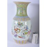 A LARGE LATE 19TH CENTURY CHINESE FAMILLE ROSE PORCELAIN VASE Qing, painted with figures under a