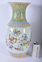A LARGE LATE 19TH CENTURY CHINESE FAMILLE ROSE PORCELAIN VASE Qing, painted with figures under a