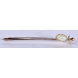 A 9 Carat Gold Bar Brooch set with a White Opal. Stamped 9CT, 5.1cm x 0.5 cm, weight 1.7g
