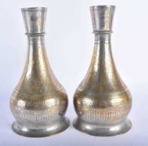 A PAIR OF 19TH CENTURY ISLAMIC MIDDLE EASTERN HOOKAH PIPE BASES decorated all over with foliage