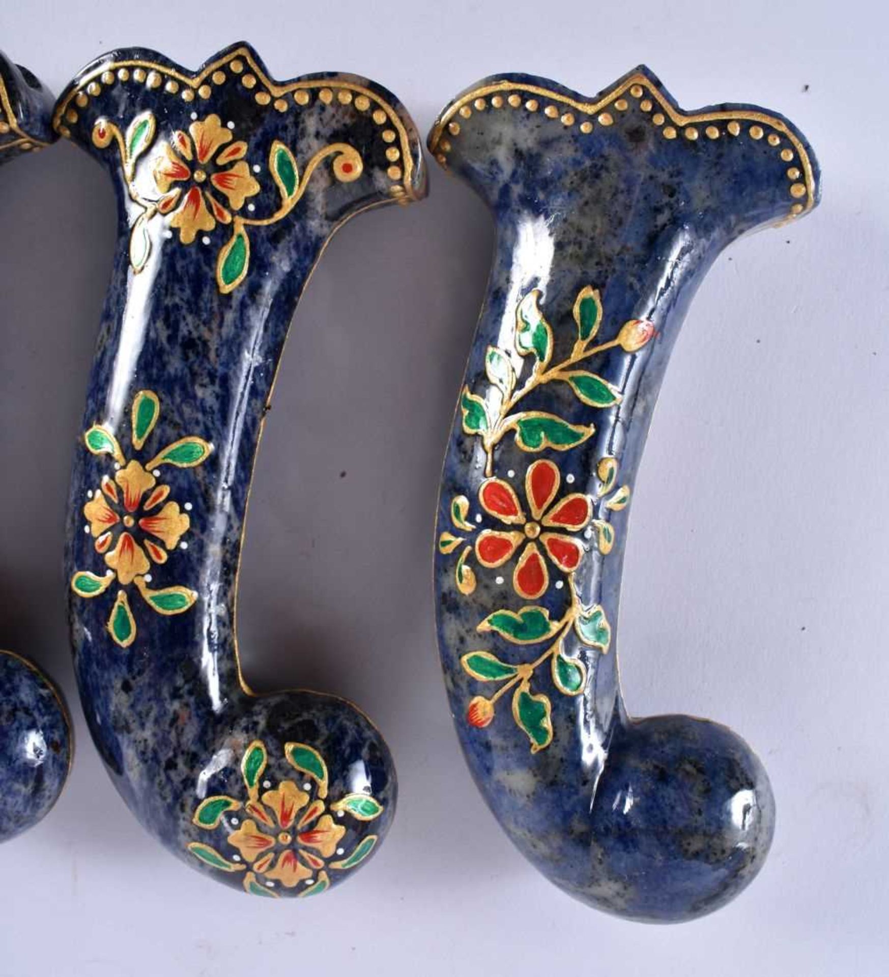 A SET OF FIVE MIDDLE EASTERN QAJAR LACQUER HARDSTONE DAGGER HANDLES overlaid with foliage and vines. - Image 2 of 6