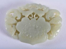 A CHINESE CARVED GREEN JADE PENDANT 20th Century. 6 cm x 4.5 cm.