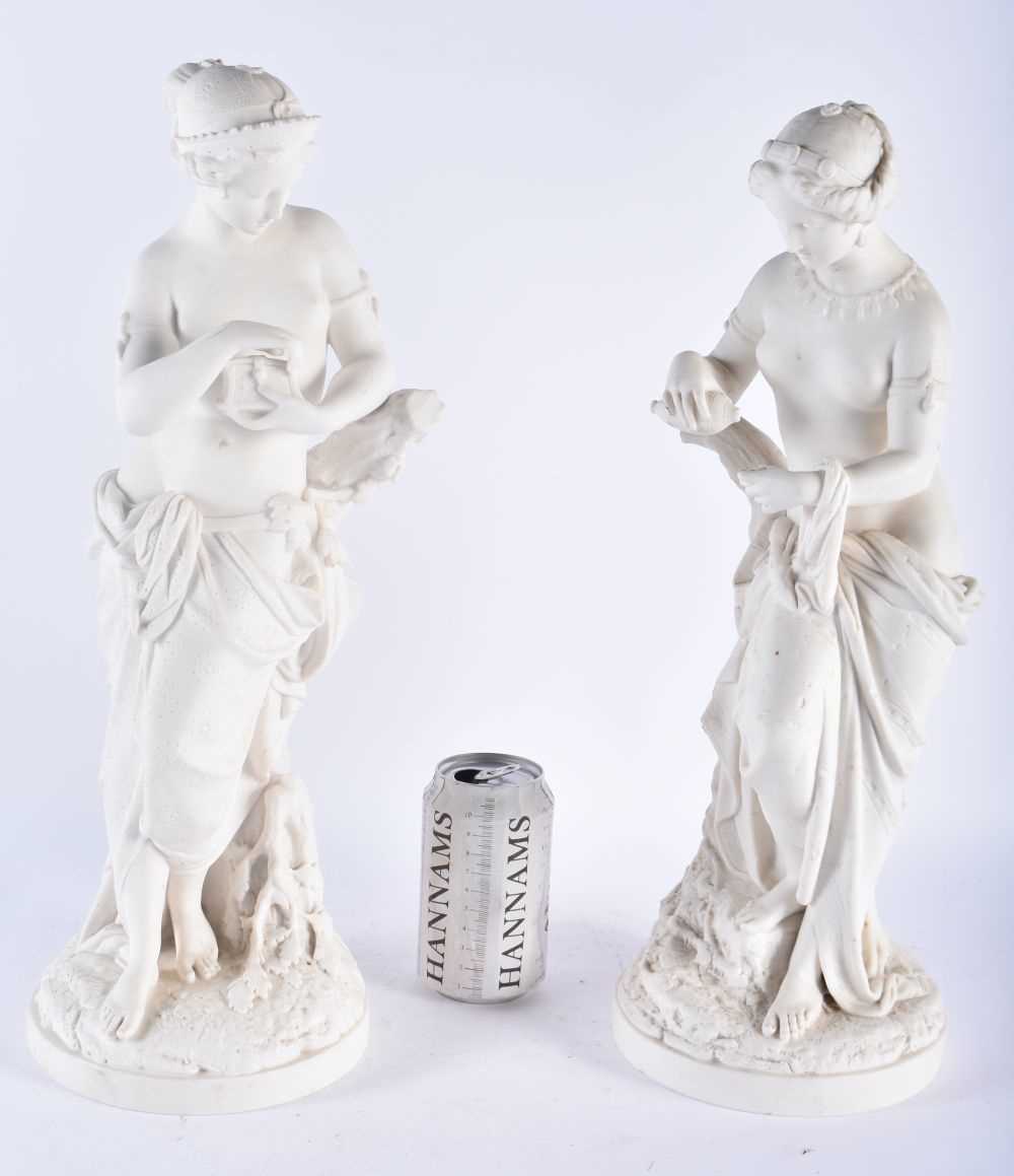 A LARGE PAIR OF 19TH CENTURY PARIAN WARE FIGURE OF FEMALES modelled upon naturalistic bases. 43 cm