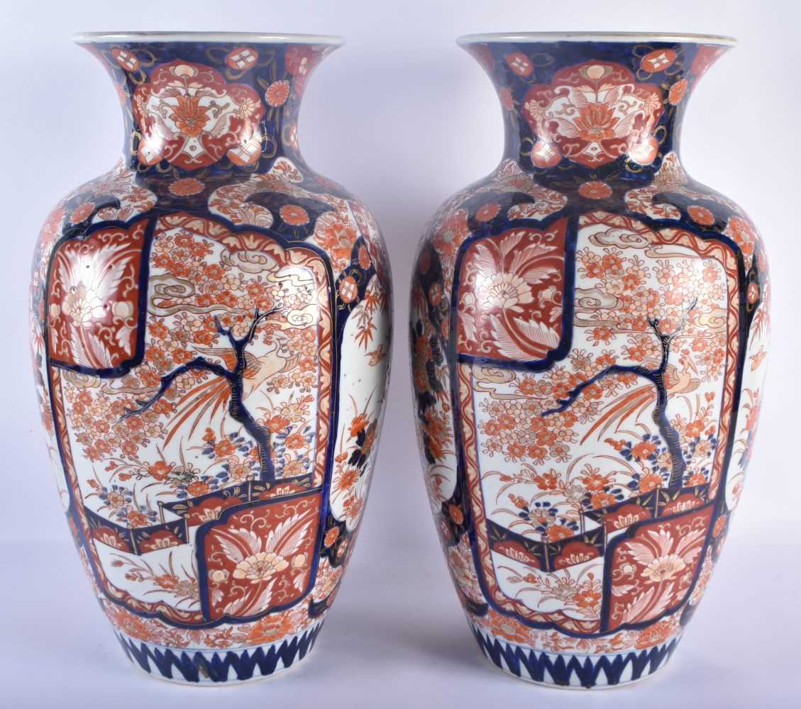 A LARGE PAIR OF 19TH CENTURY JAPANESE MEIJI PERIOD COUNTRY HOUSE IMARI VASES painted with foliage - Image 2 of 6