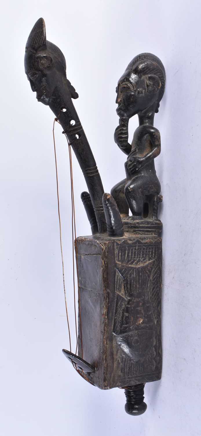 An Ethnographic Tribal Figurative Harp (Domu) from the Mangbetu People. 43cm x 9cm x 12cm