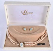 A SILVER COSTUME PEARL NECKLACE. 32 grams. Largest 38 cm long.