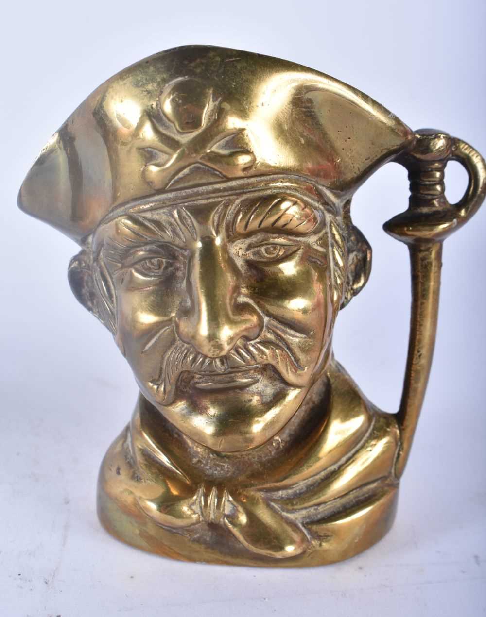 A RARE PAIR OF 19TH CENTURY ENGLISH BRONZE CHARACTER JUGS modelled as male and pirate. 11cm x 9 cm. - Image 3 of 5