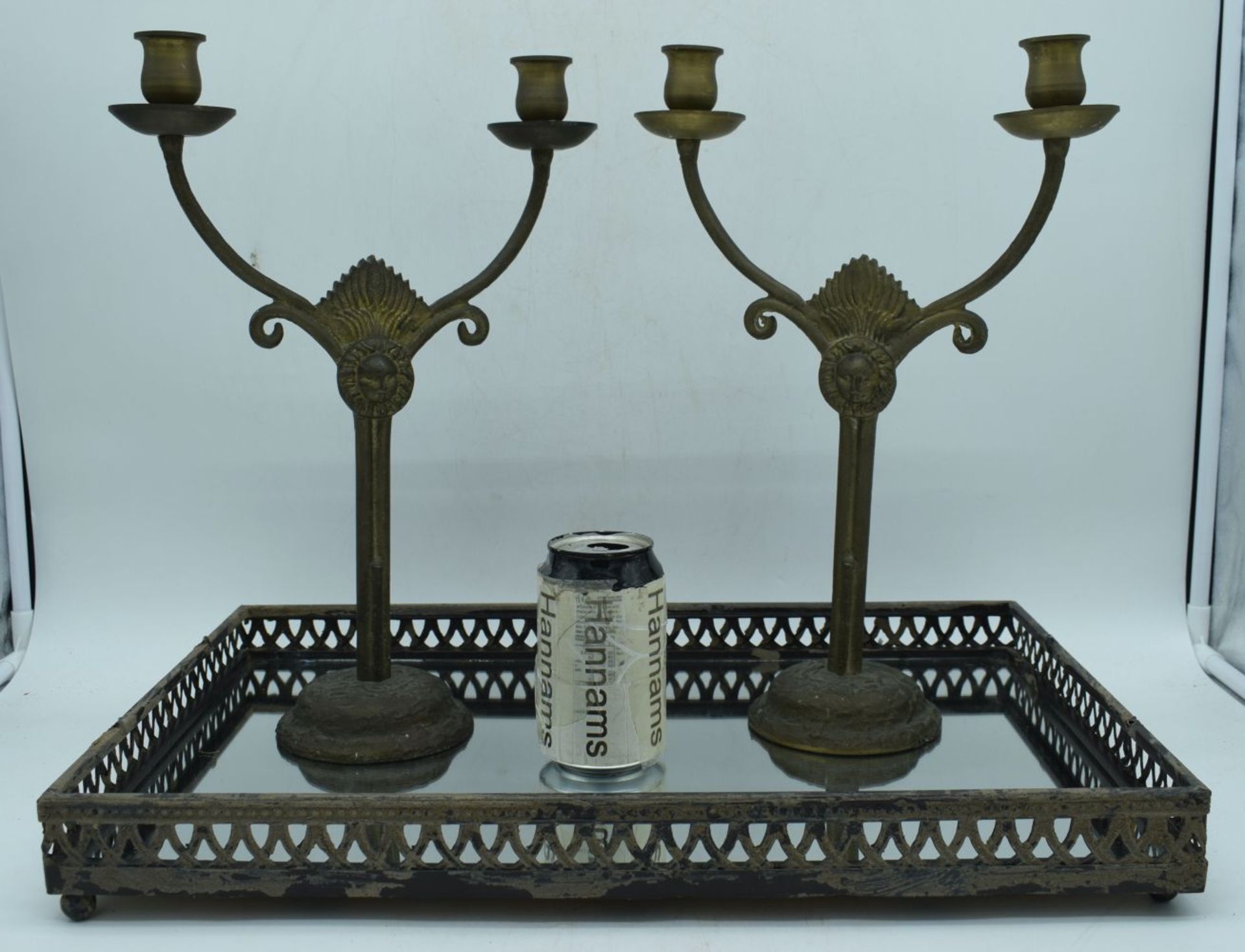 A pair of gilt metal candlesticks together with a mirrored metal galleried tray 50 x 32 cm (3).