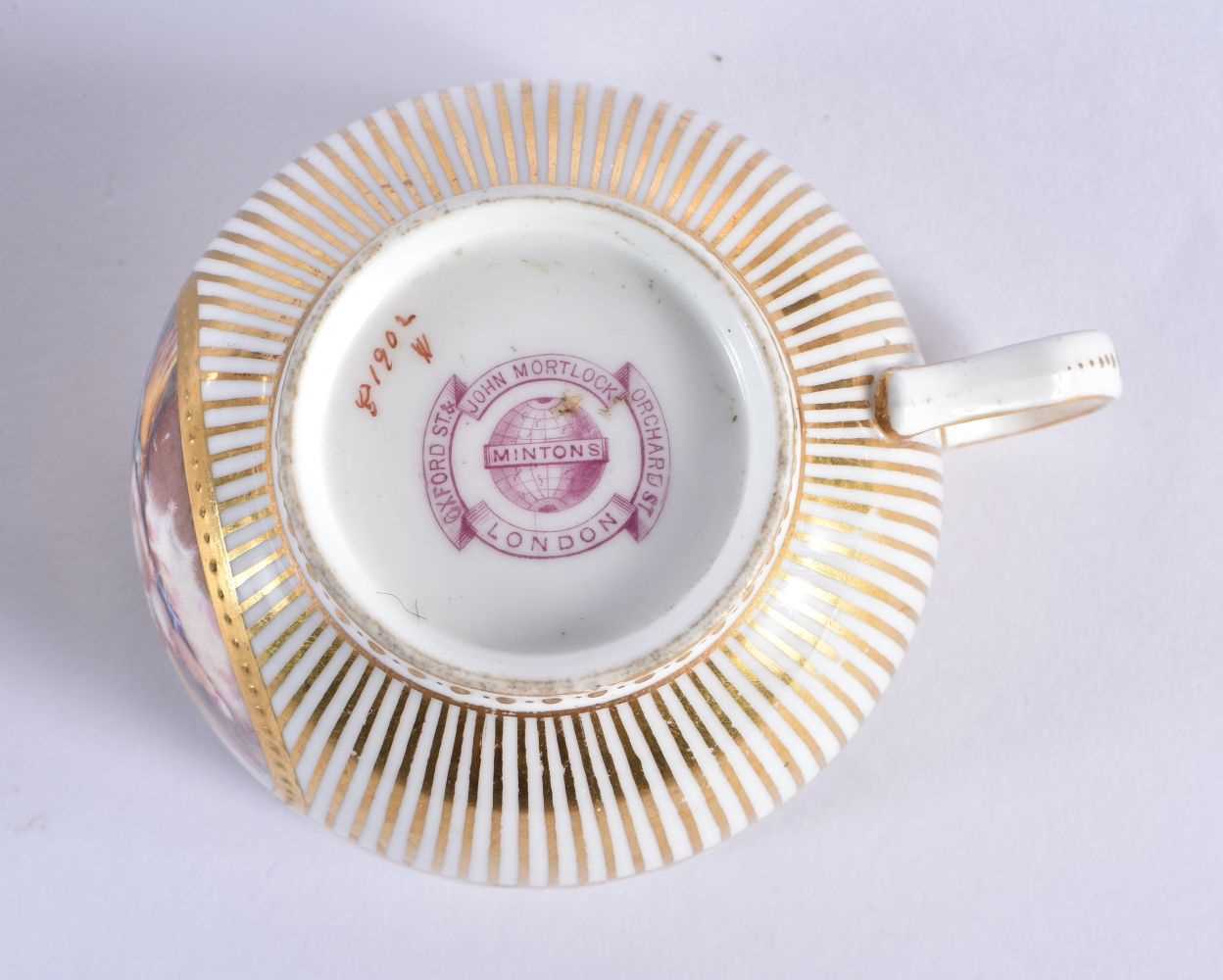 Minton teacup and saucer painted with a naked baby laying on a straw mattress, globe mark, made - Image 3 of 19