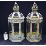 A pair of metal and glass lanterns 62 cm.(2)