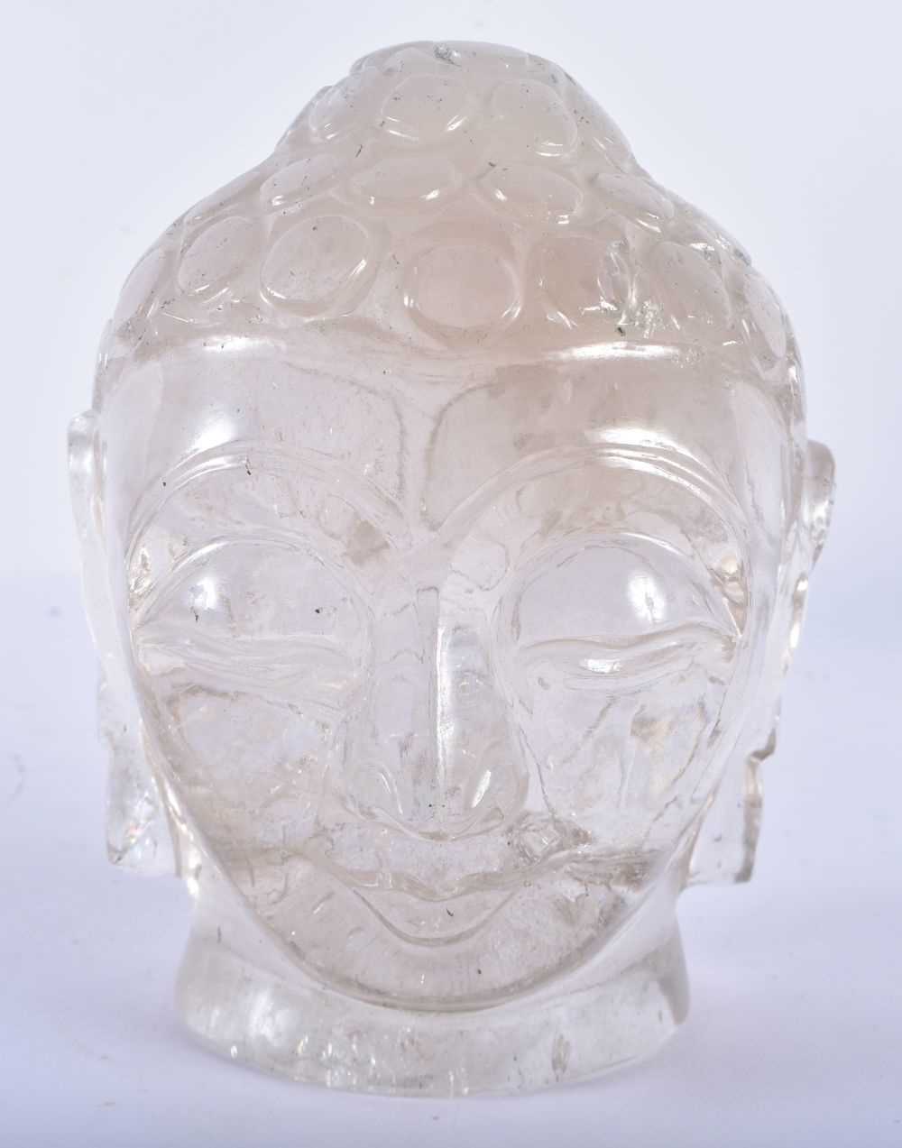 A LARGE 19TH CENTURY CHINESE CARVED ROCK CRYSTAL BUDDHA HEAD Qing, surrenly modelled upon an