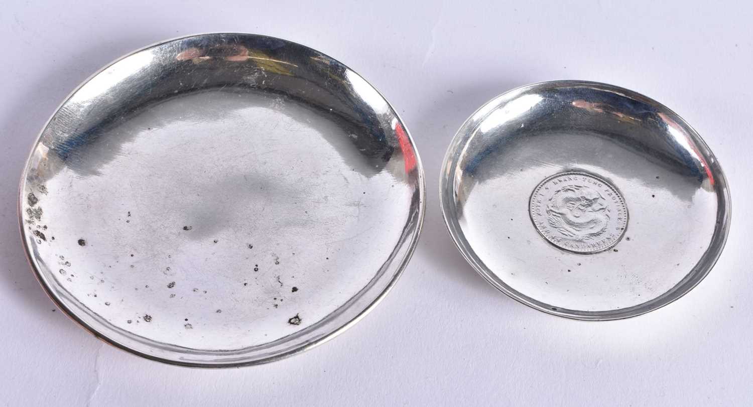 TWO ANTIQUE CHINESE SILVER COIN DISHES. 88.3 grams. Largest 9.25cm wide. (3)