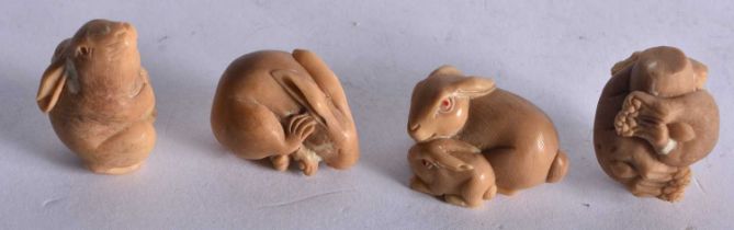 Four Nut Netsukes carved as Rabbits in various poses. Largest 3.2 cm x 2.3 cm x 2.1cm, total
