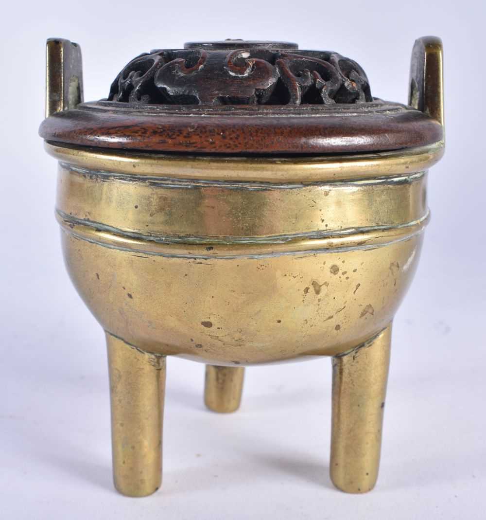 A 19TH CENTURY CHINESE TWIN HANDLED BRONZE QING CENSER, with hardwood cover. 11cm x 9 cm. - Image 3 of 14