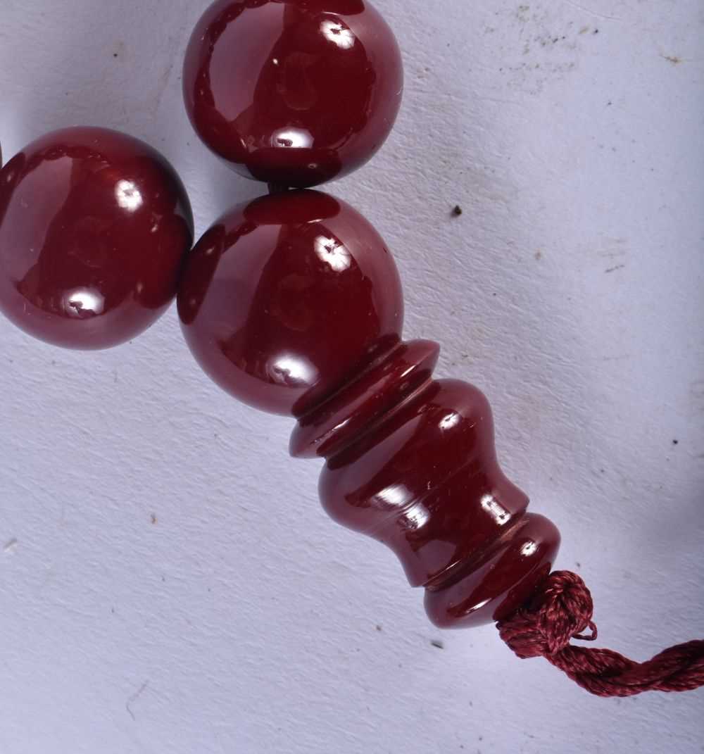 A TURKISH CHERRY AMBER TYPE TESBIH NECKLACE. 93 grams. 94 cm long. - Image 3 of 4