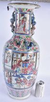 A LARGE 19TH CENTURY CHINESE FAMILLE ROSE PORCELAIN VASE Qing, painted with figures in interiors. 60