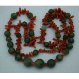 A CORAL AND JADE NECKLACE. 59 grams. 68 cm long.