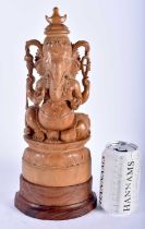 A LATE 19TH CENTURY INDIAN CARVED SANDALWOOD FIGURE OF GANESHA. 33 cm x 10 cm.
