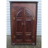 A Mahogany inlaid hanging corner cupboard 138 x 88 x 52 cm.