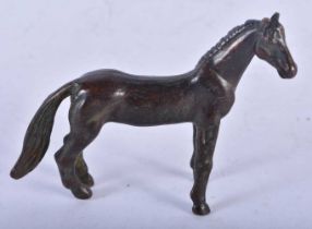 A Bronze Model of a Horse. 8.7cm x 7cm x 2.2 cm, weight 129g