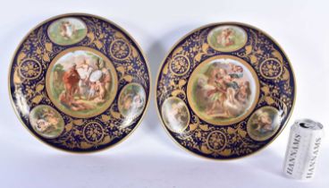 A PAIR OF EARLY 20TH CENTURY VIENNA AUSTRIAN PORCELAIN DISHES gilded with rich foliage, decorated