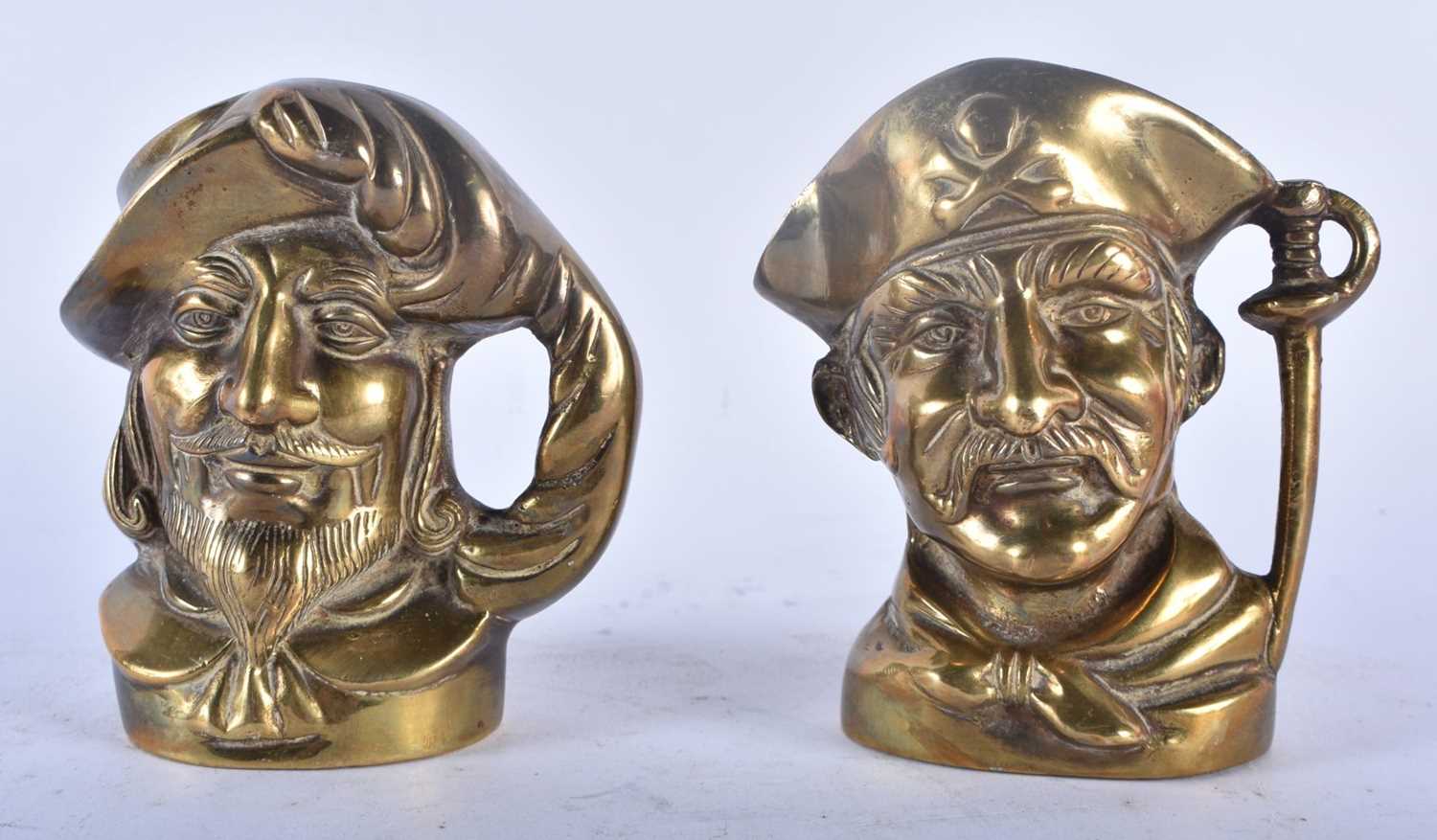 A RARE PAIR OF 19TH CENTURY ENGLISH BRONZE CHARACTER JUGS modelled as male and pirate. 11cm x 9 cm.