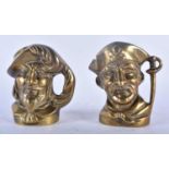 A RARE PAIR OF 19TH CENTURY ENGLISH BRONZE CHARACTER JUGS modelled as male and pirate. 11cm x 9 cm.