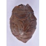 A naive coconut shell Bugbear powder flask carved as a fish. 7.5 cm x 5.2 cm, weight 106g