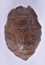 A naive coconut shell Bugbear powder flask carved as a fish. 7.5 cm x 5.2 cm, weight 106g