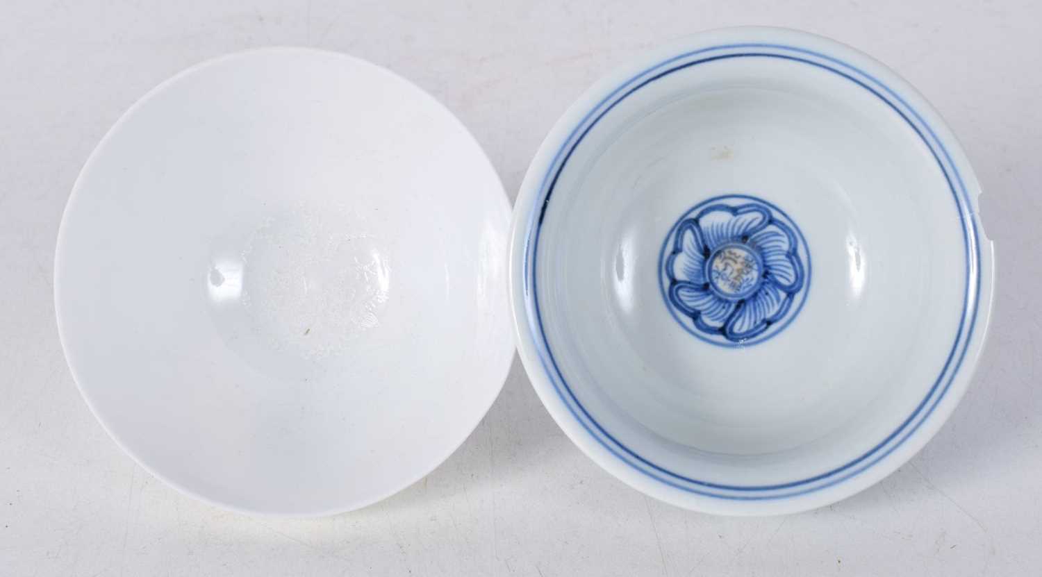 A Chinese porcelain blue and white tea bowl decorated with foliage together with another tea bowl - Image 3 of 6