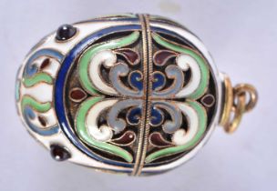 A Continental Silver Gilt and Enamel Egg Pendant. Stamped 84, 3.2 cm x 2.1cm, weight 9.5g