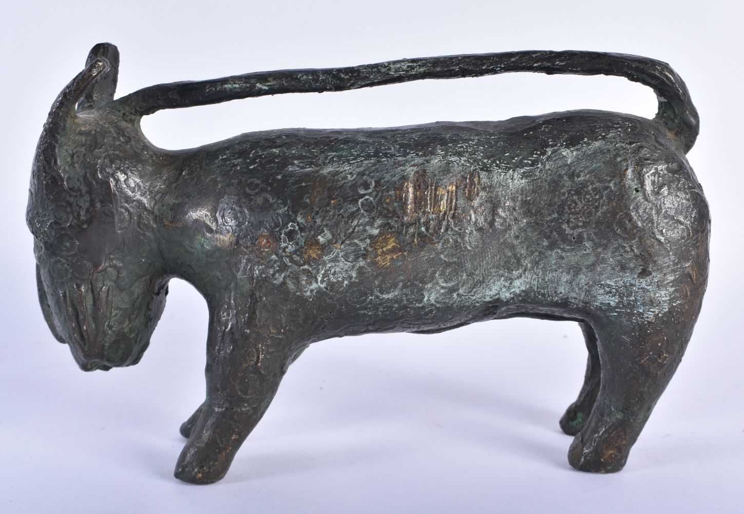 AN ANTIQUE TRIBAL AFRICAN HEAVY BRONZE BENIM BEAST unusually formed with a tail handle. 20 cm x 12