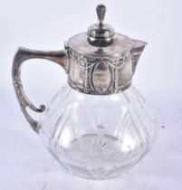 A LARGE EARLY 20TH CENTURY CONTINENTAL SILVER AND CUT GLASS CLARET JUG. 26cm x 18cm.