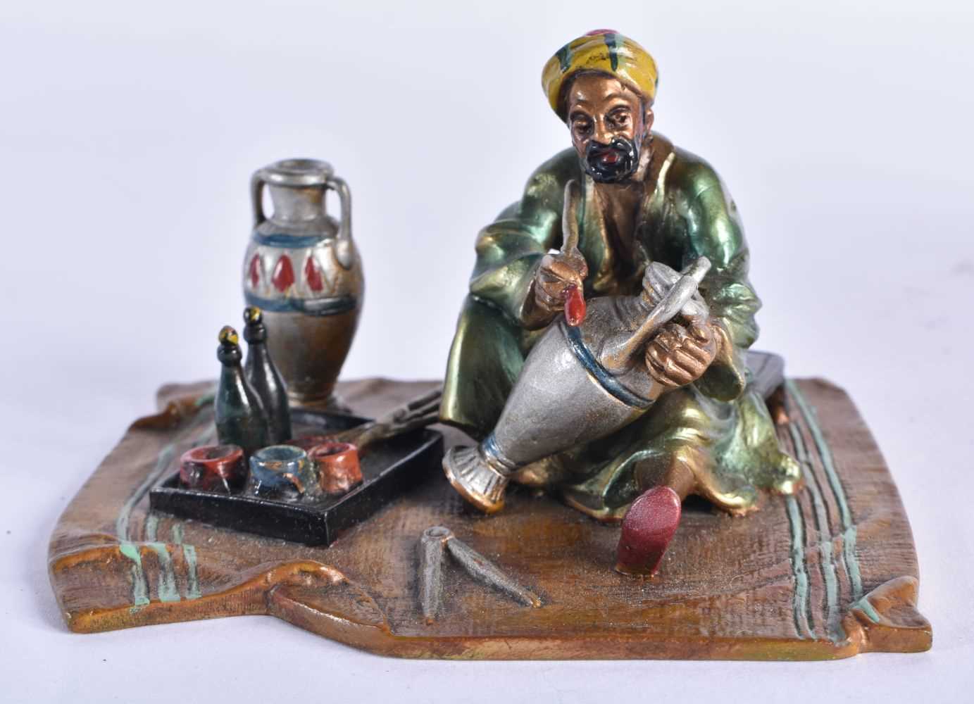 AN AUSTRIAN COLD PAINTED BRONZE FIGURE OF A TURKISH TRADESMAN. 10 cm x 8 cm.