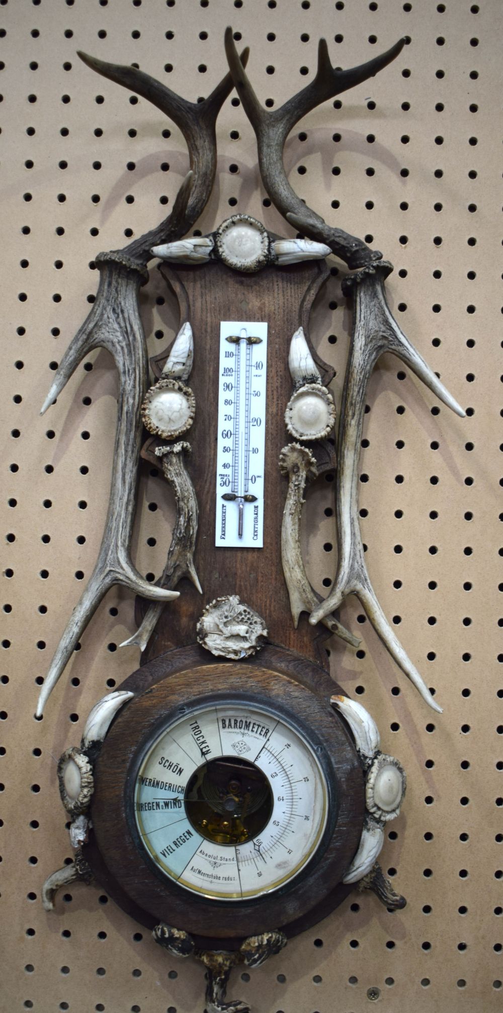 An early 20th Century wooden and antler horn Barometer and thermometer 69 cm.