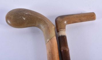 TWO 19TH CENTURY MIDDLE EASTERN CARVED RHINOCEROS HORN WALKING CANES. Largest 90 cm long. (2)