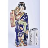 A 19TH CENTURY JAPANESE MEIJI PERIOD AO KUTANI PORCELAIN GEISHA modelled holding a fan. 30cm x 12