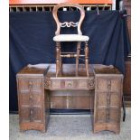 An antique oak dressing table with seven drawers together with a Balloon back Chair 78 x 121 x 50 cm