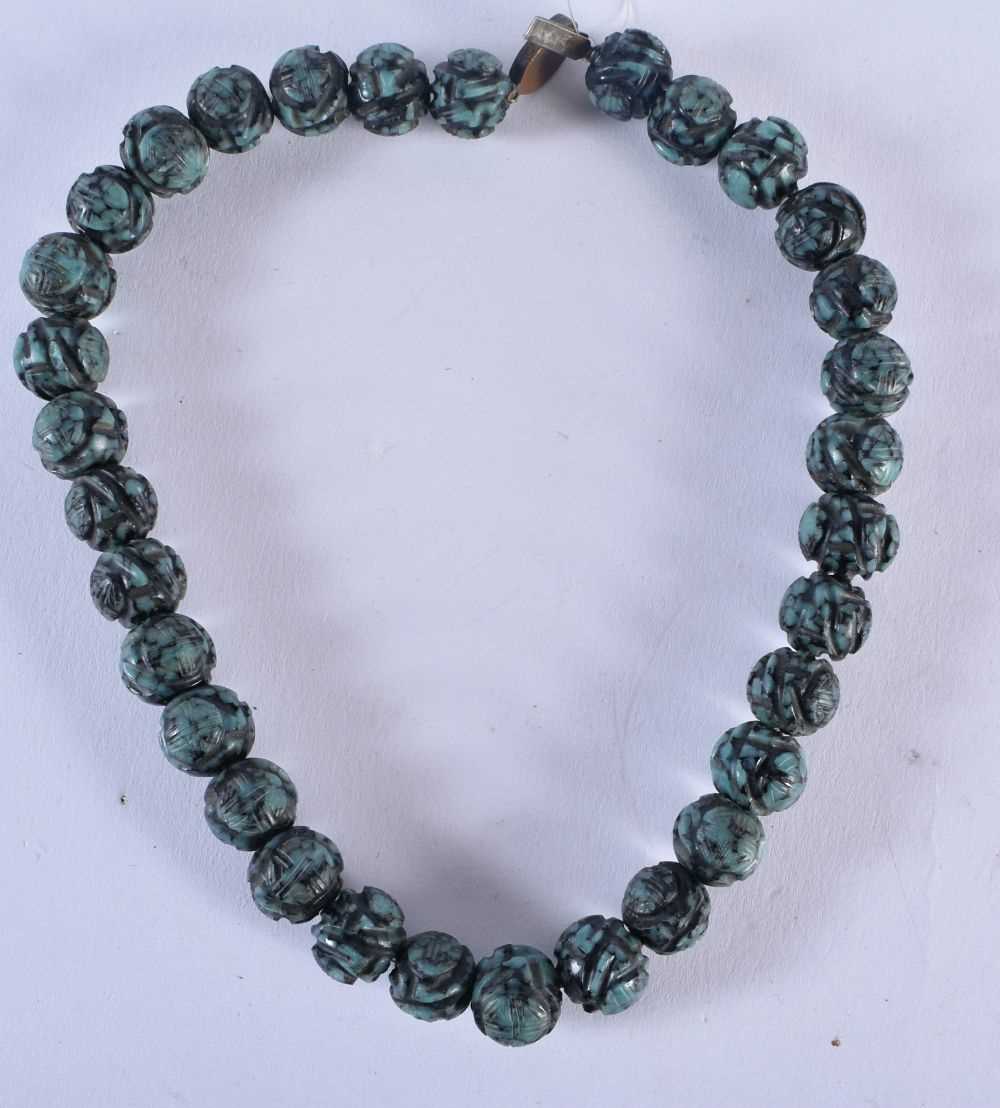 A 19TH CENTURY CHINESE CARVED TURQUOISE NECKLACE Qing. 73 grams. 34 cm long. - Image 4 of 4