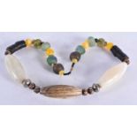 A Tribal Necklace made with Trade Beads. 63cm long. Largest Bead 7cm long`