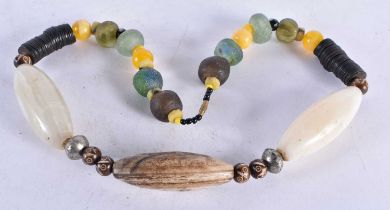 A Tribal Necklace made with Trade Beads. 63cm long. Largest Bead 7cm long`