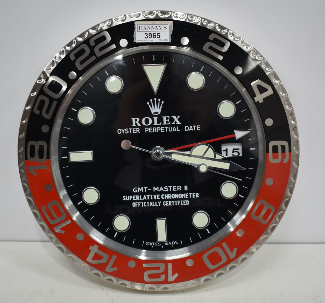 A Contemporary Rolex style dealership clock 33 cm.