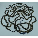 A collection of African Tribal Baule brass bead necklaces together with 2 bracelets largest 88 cm (