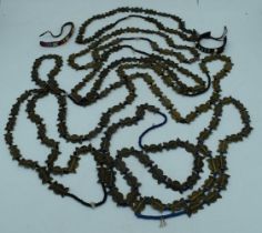 A collection of African Tribal Baule brass bead necklaces together with 2 bracelets largest 88 cm (