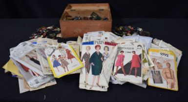 A collection of vintage buttons and dress/clothes making patterns (Qty).