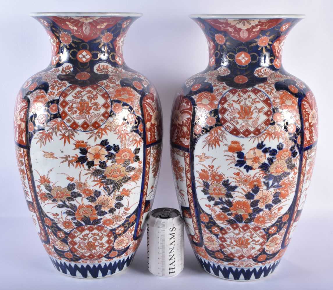 A LARGE PAIR OF 19TH CENTURY JAPANESE MEIJI PERIOD COUNTRY HOUSE IMARI VASES painted with foliage