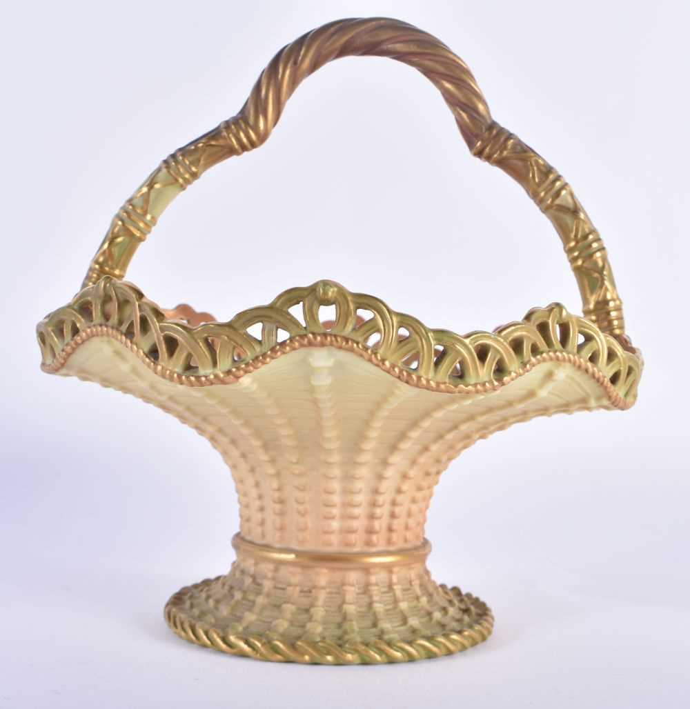 Royal Worcester blush ivory basket, with over handle, pierced wavy rim, spreading cylindrical