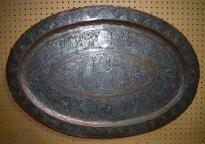 An early large Persian copper and white metal tray heavily embossed with figures and animals 92 x 63