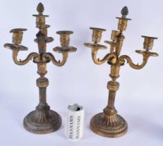 A LARGE PAIR OF 19TH CENTURY FRENCH BRONZE TRIPLE BRANCH CANDELABRA formed with scrolling arms. 45cm