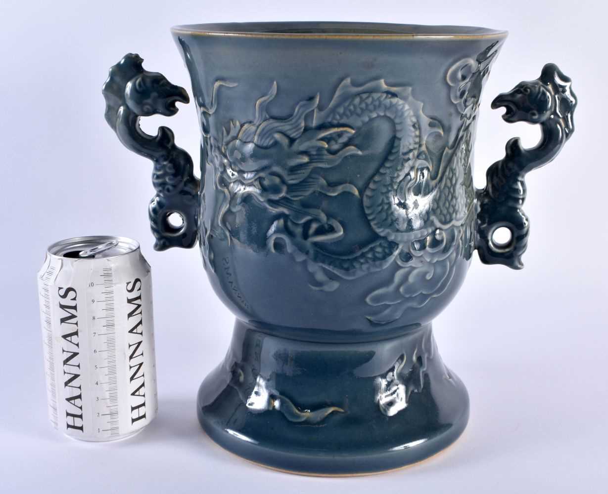 A LARGE CHINESE QING DYNASTY TWIN HANDLED BLUE STONEWARE PORCELAIN VASE decorated in relief with